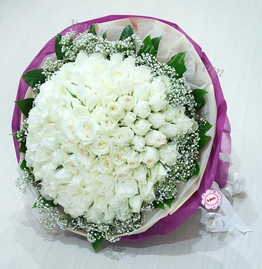 white roses hand bouquet